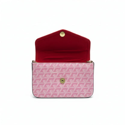Pink patterned handbag with open red interior on a white background