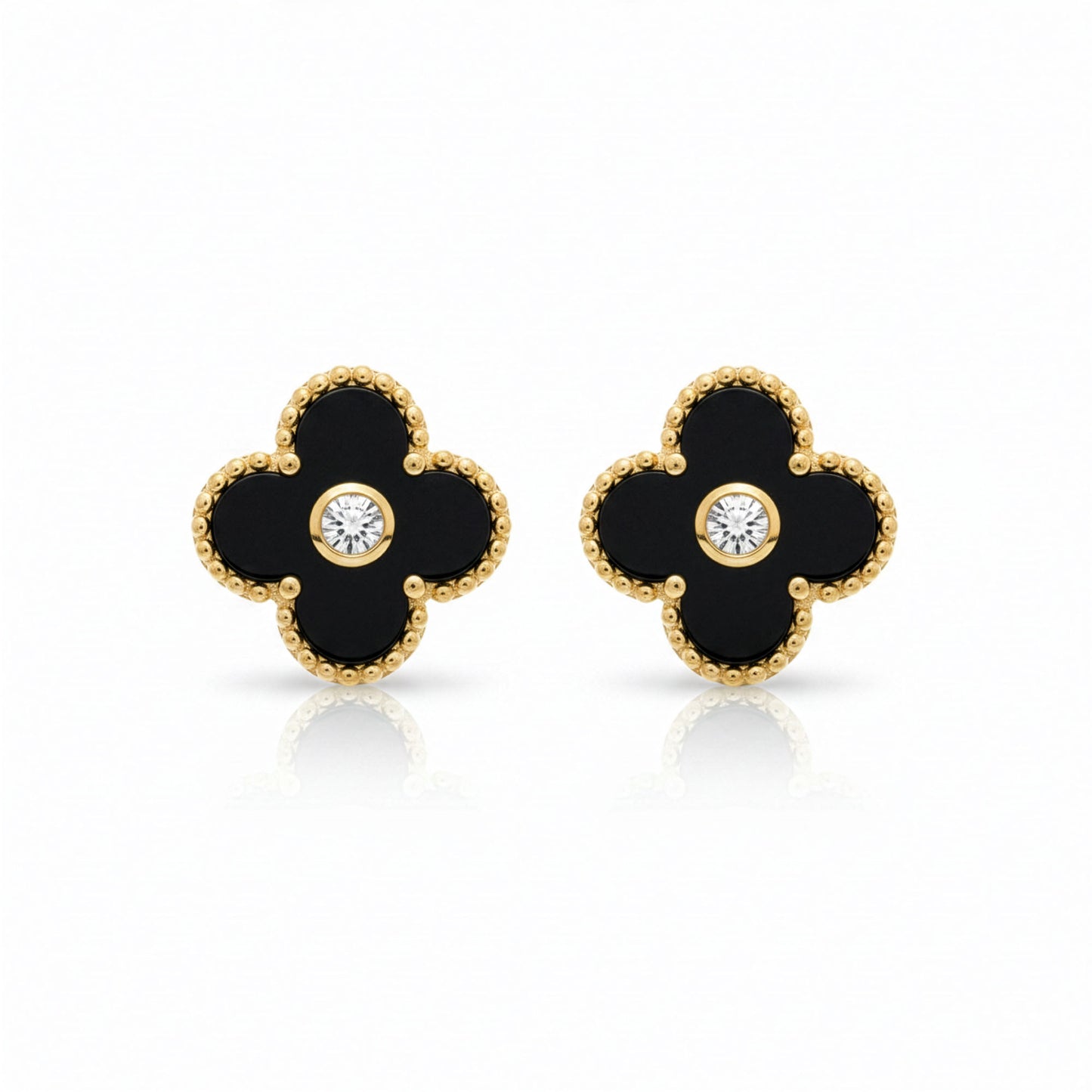 Boucles Trèfle Lumière Onyx — clous onyx noir cristal central doré flatlay — Beauty Store Maroc