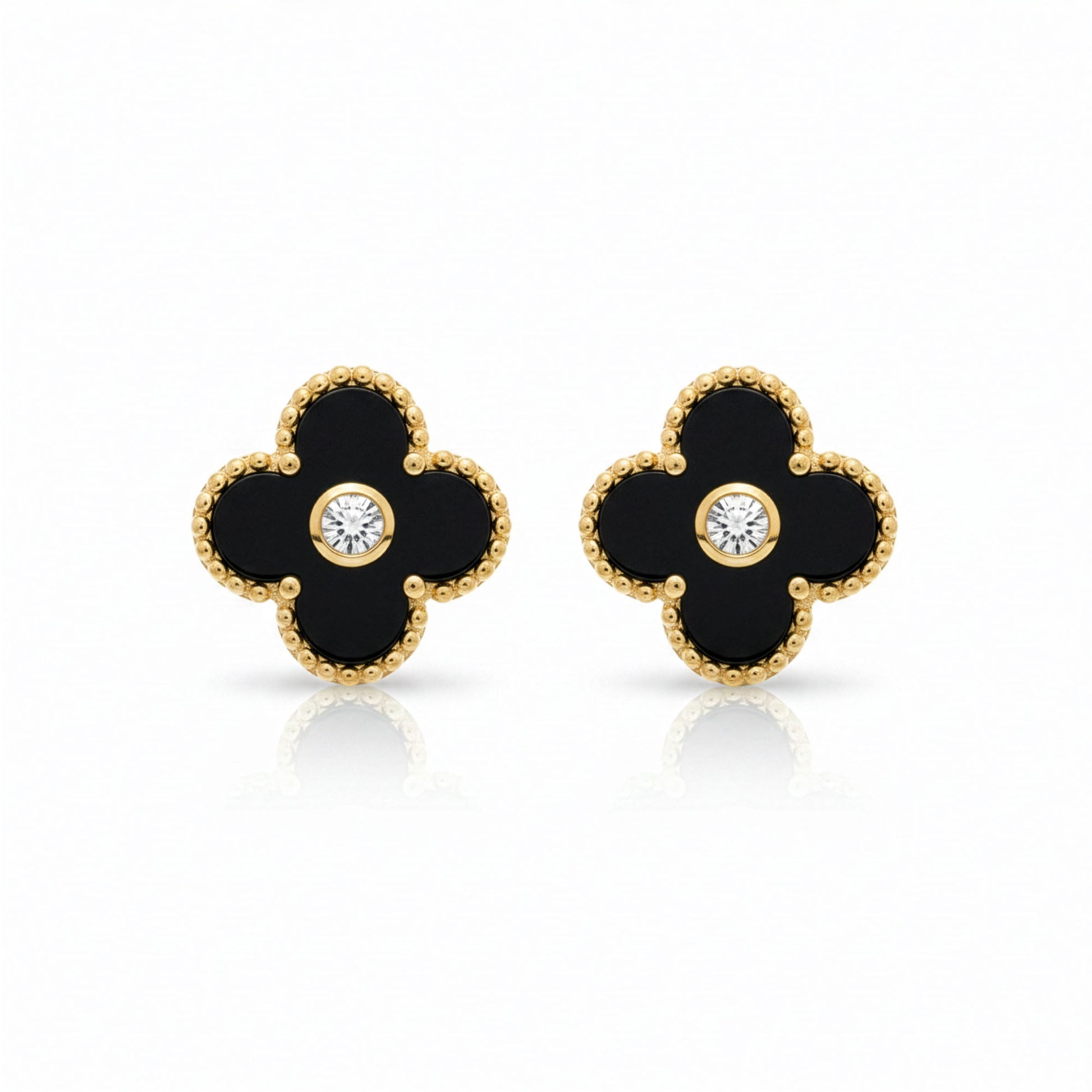 Boucles Trèfle Lumière Onyx — clous onyx noir cristal central doré flatlay — Beauty Store Maroc